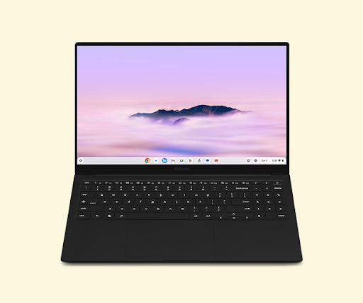 A sleek black Samsung Chromebook laptop with its screen displaying a scenic mountain range above clouds.