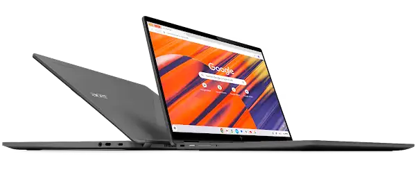 A sleek, dark grey Acer Chromebook laptop is open, displaying the Google Chrome browser with a vibrant abstract wallpaper on its screen.
