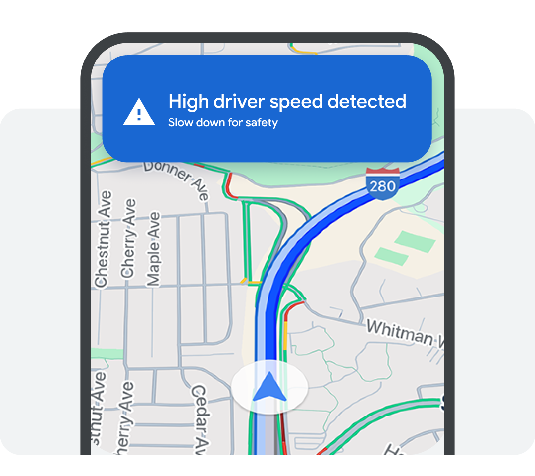 Smartphone map displaying a blue safety alert: High driver speed detected. Slow down for safety.