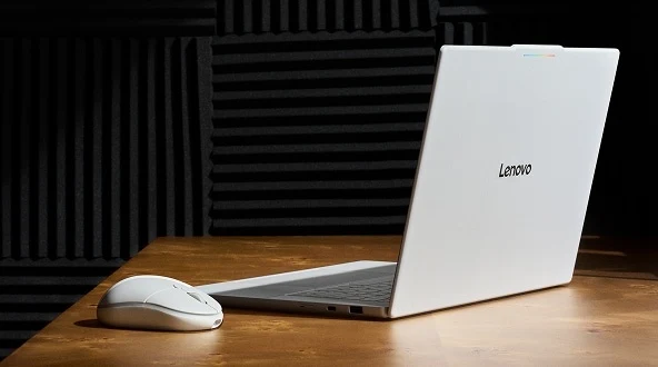 An open Lenovo Googlebook laptop and Lenovo AI mouse sitting on table.