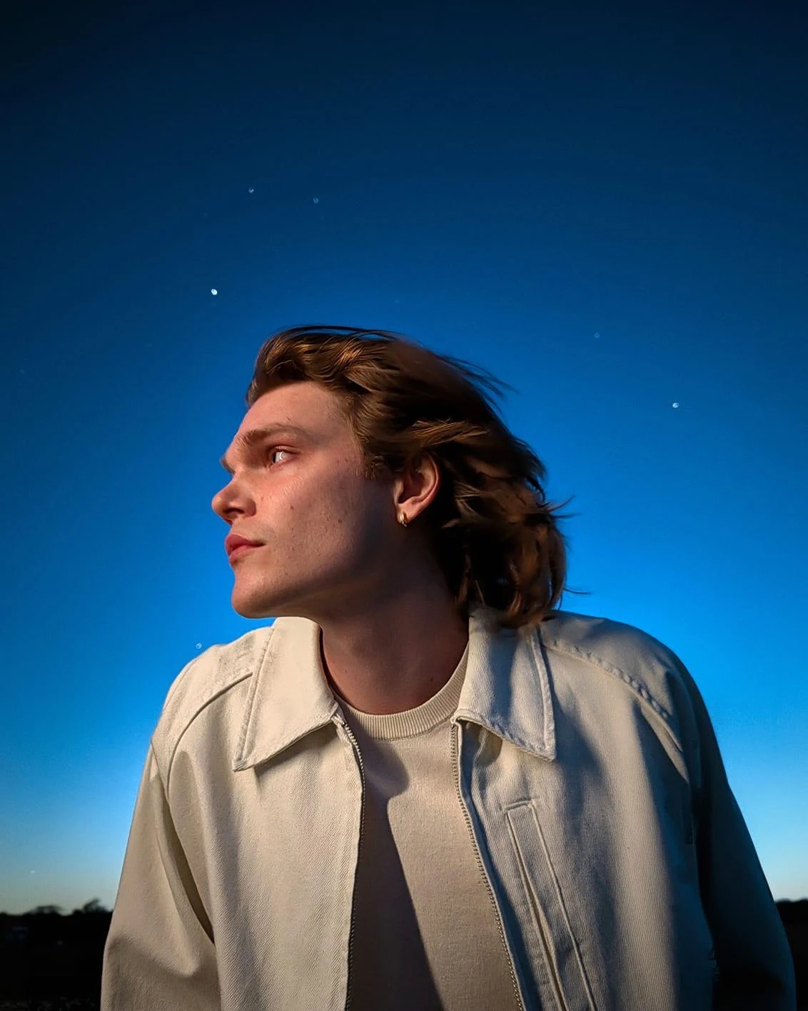 Perfectly lit portrait of a person at dusk.