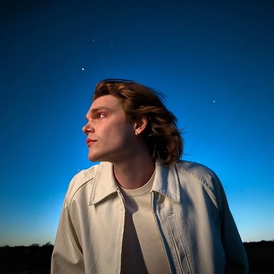Perfectly lit portrait of a person at dusk.