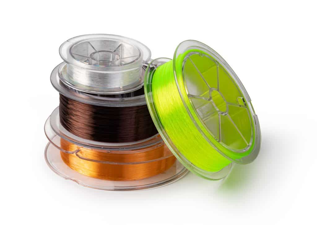 Best Fishing Line for Trout: A Comprehensive Guide to Choosing the Right One 3 spools of fishing line stacked on top of each other