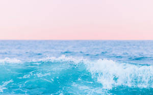 Calm ocean wave with white foam under pink and blue sunset sky — Sky Wallpaper