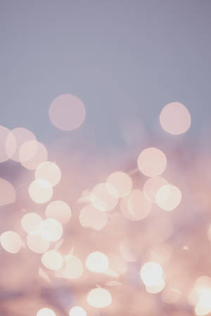 Glowing bokeh lights in soft pastel tones against a gradient sky. — Heart Wallpaper