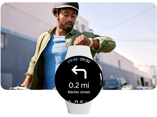 In the foreground, a smartwatch with Google Maps open. In the background, a person on a bike is checking their smartwatch.